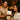 Spa professional handing a thank-you card to a smiling client