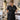 Professional waxing apron with scattered wax spots illustrating how wax residue transfers onto esthetician workwear during salon waxing services
