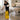 Yellow wet floor sign standing in a spa or salon, emphasizing safety and injury prevention for clients and staff in a professional beauty environment.