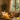 Spa professional adjusting music playlist for different times of day in a beautiful salon setting
