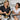 Salon owner training new esthetician on professional facial equipment