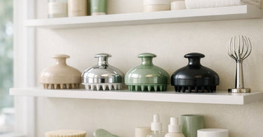 A curated retail display featuring various scalp massagers and scalp care products in a modern salon setting
