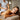 Woman getting a dry brushing exfoliation treatment in a spa.