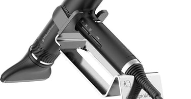 Professional hair dryer holder mounted on salon station keeping tools organized
