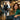 A woman looking surprised and slightly panicked from inside a salon treatment room, peering out through a slightly open door at a blurred figure in the waiting room.
