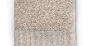 Zenith Collection Turkish washcloths in French Beige displayed in a spa setting